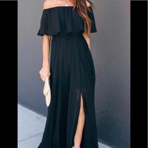 Off the shoulder black maxi dress with side slit.